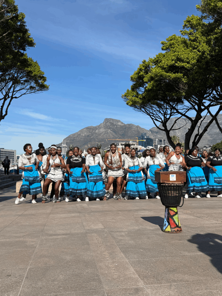 Family exploring Cape Town with Table Mountain in the background.