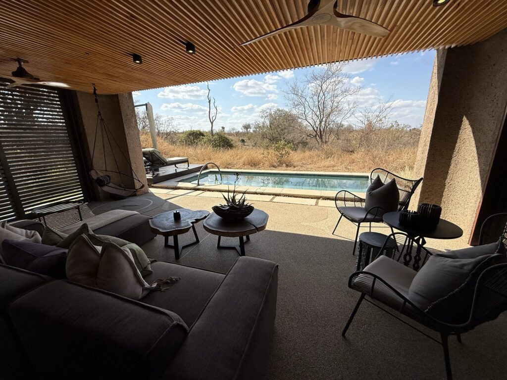 Spacious luxury suite at Sabi Sands Earth Lodge with elegant safari-inspired design.
